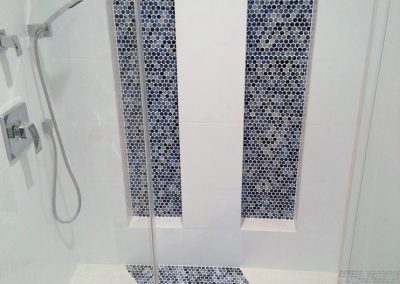 Shower with tile accents.